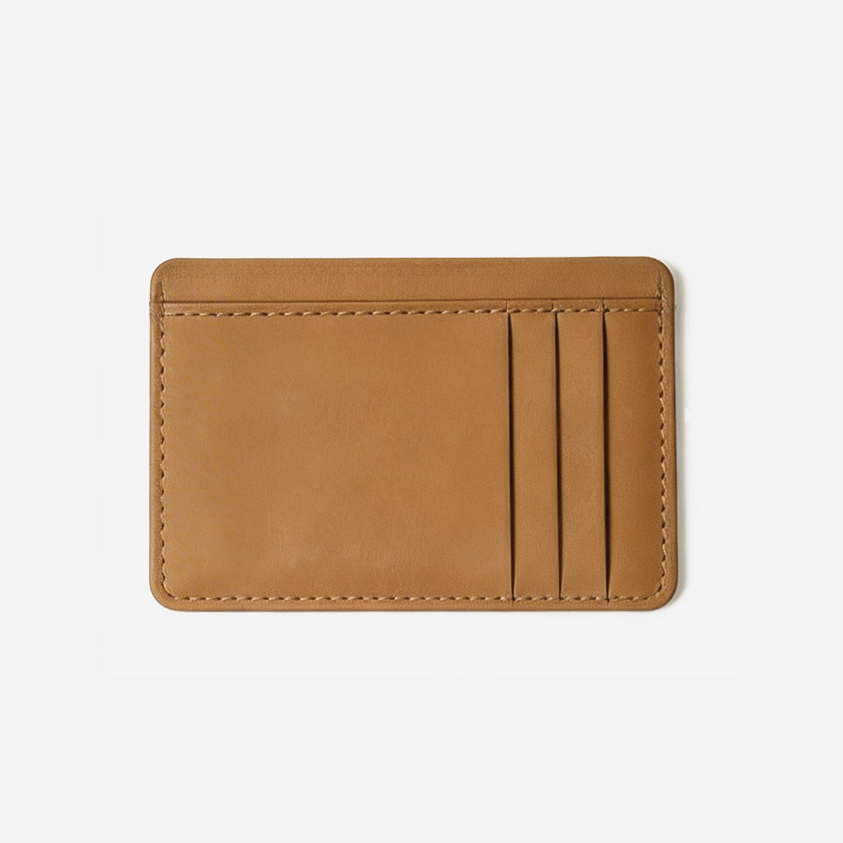 Tan leather cardholder on a light gray background - Saddle