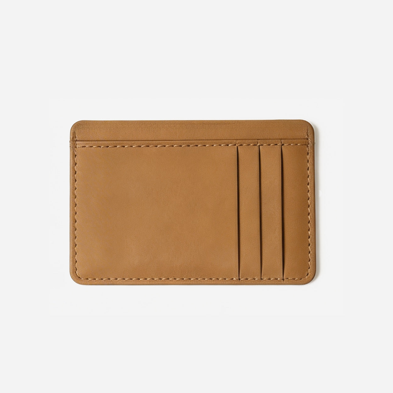 Tan leather cardholder on a light gray background - Saddle