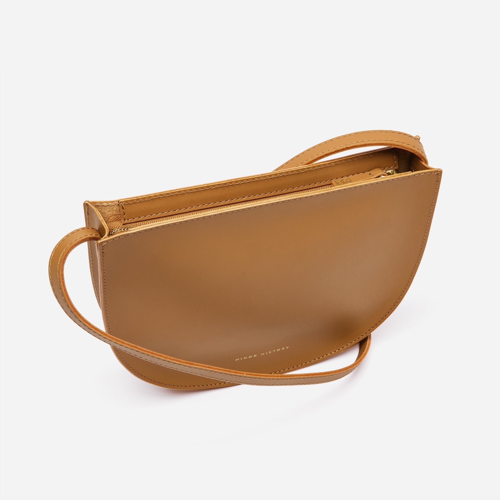 Minor History Sidekick Crossbody in saddle leather, flat lay