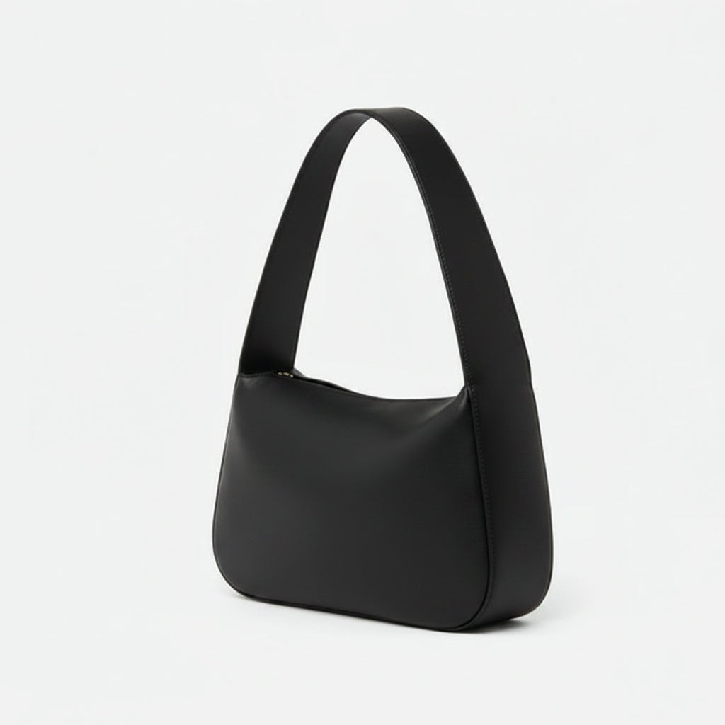 Black handbag on a light gray background -Black