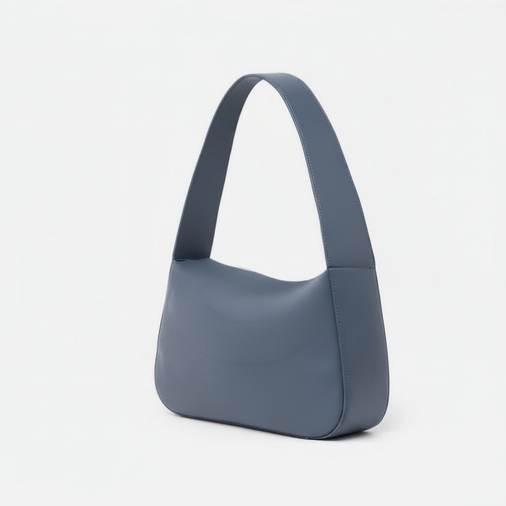 Blue handbag on a light gray background - Chambray