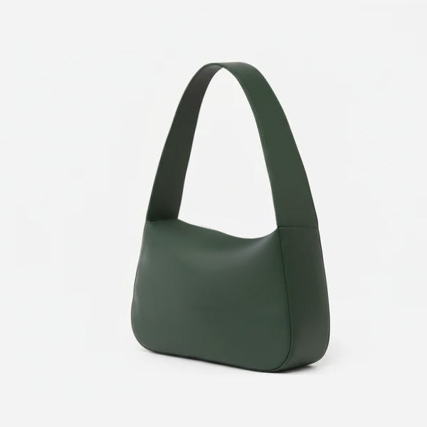Green handbag on a light gray background - Evergreen