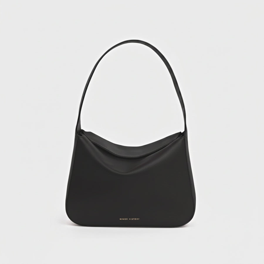 Black Frame Shoulder Bag, front view showing the curved top and shoulder strap - Black