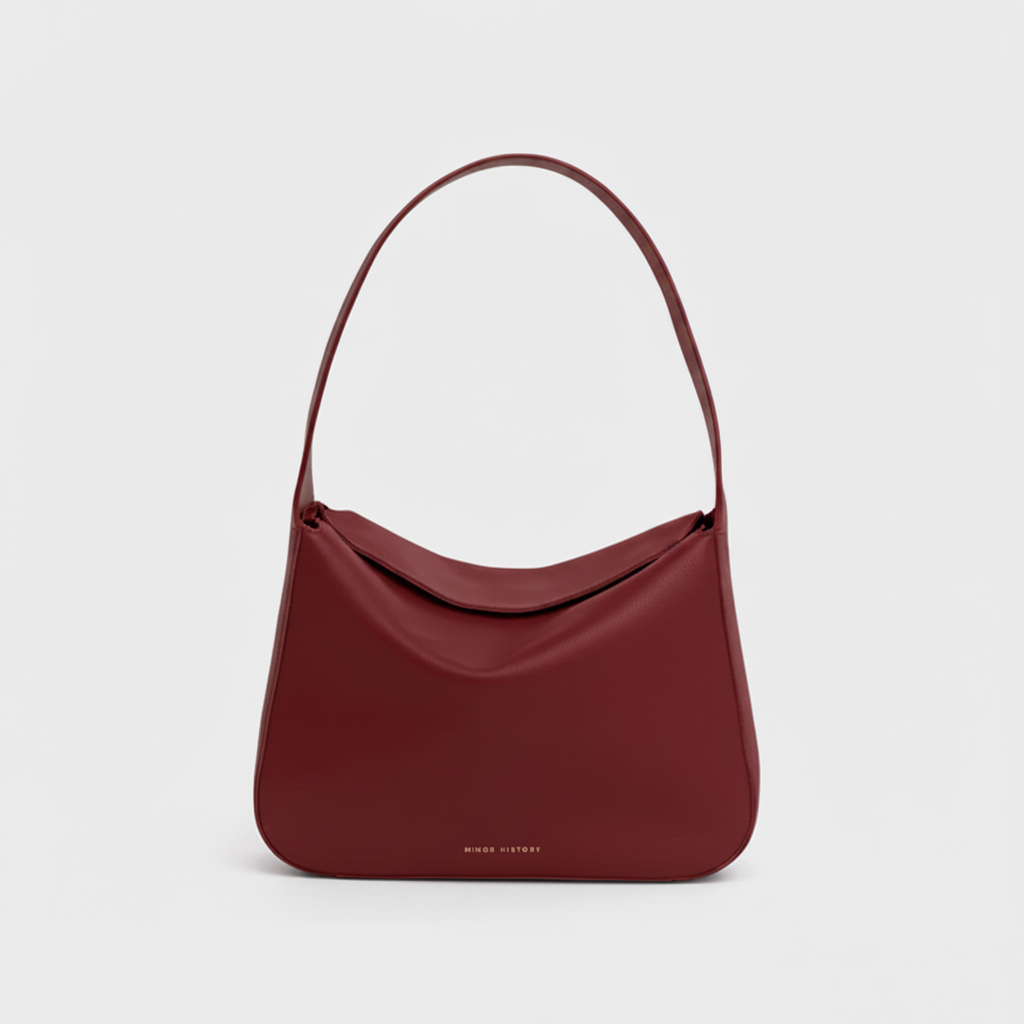Red handbag on a light gray background - Cherry Cola