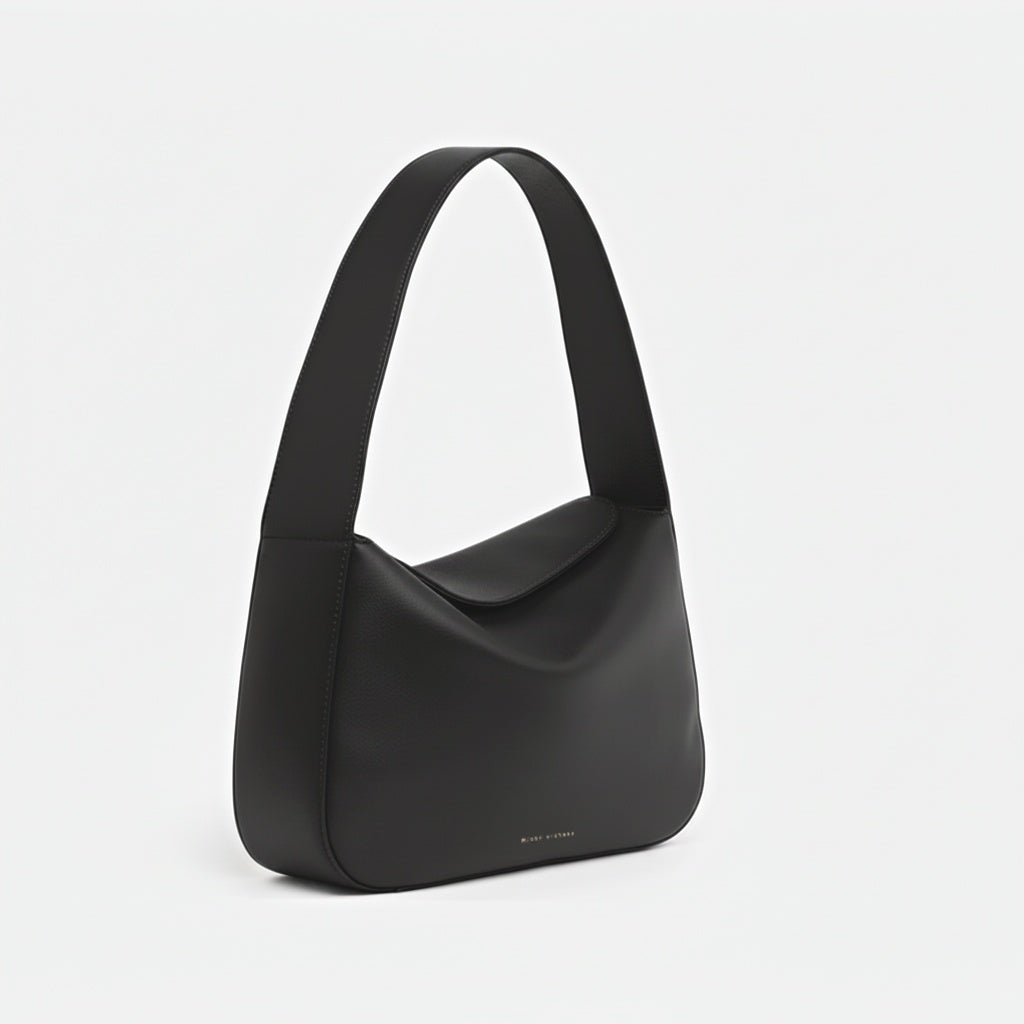 Black handbag on a light gray background -Black