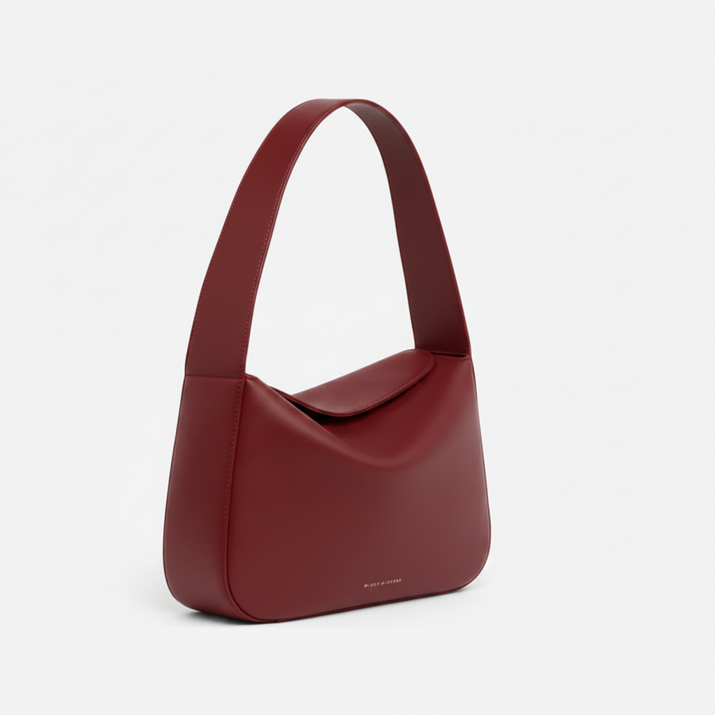 Red handbag on a light gray background - Cherry Cola