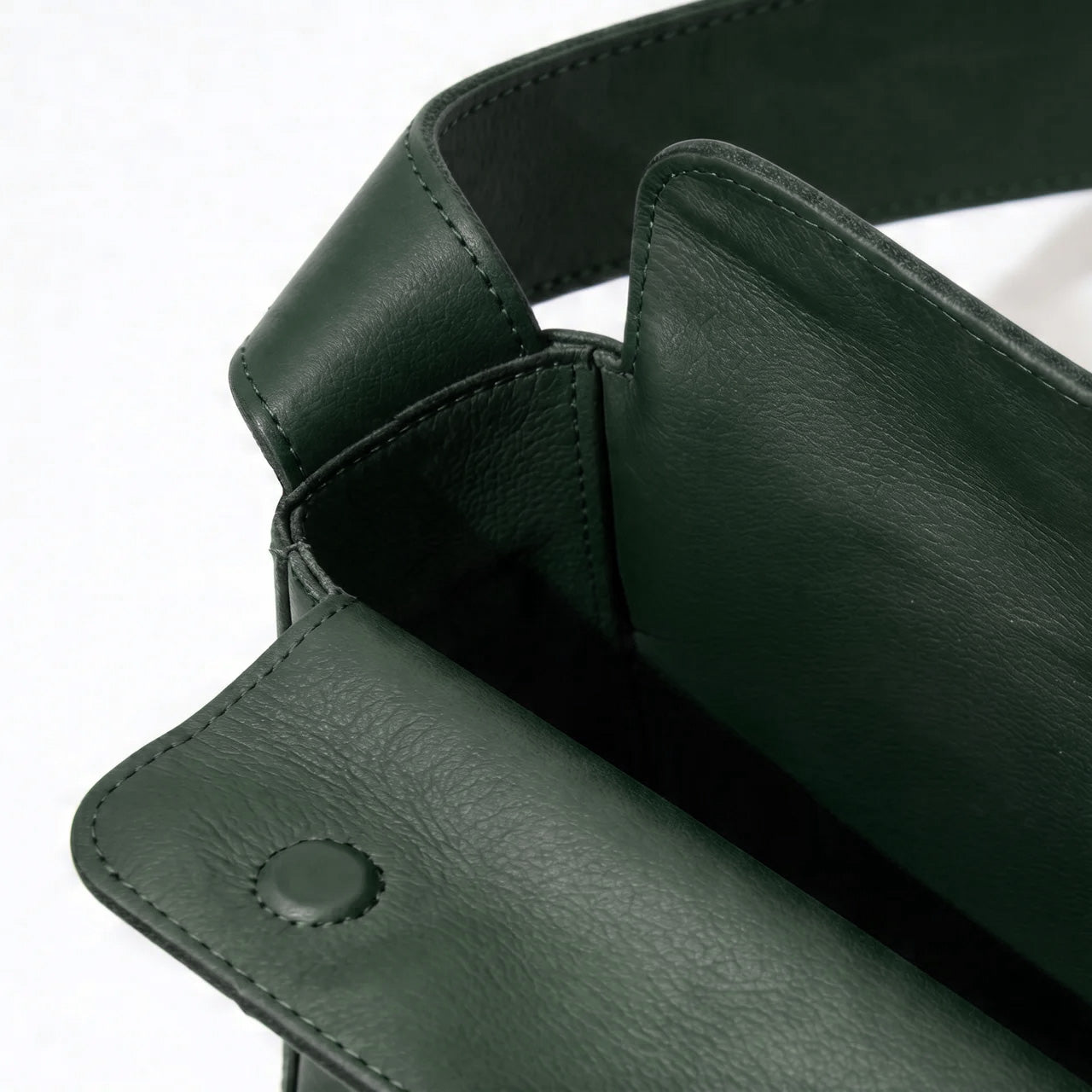 Close-up of a black leather product with a white background - Evergreen