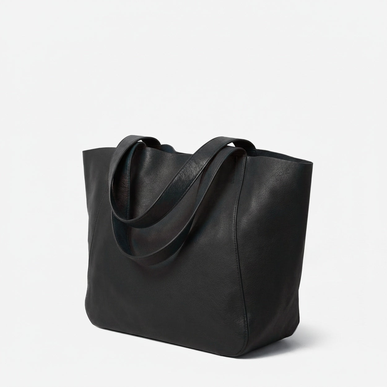 Black leather tote bag on a light gray background - Black