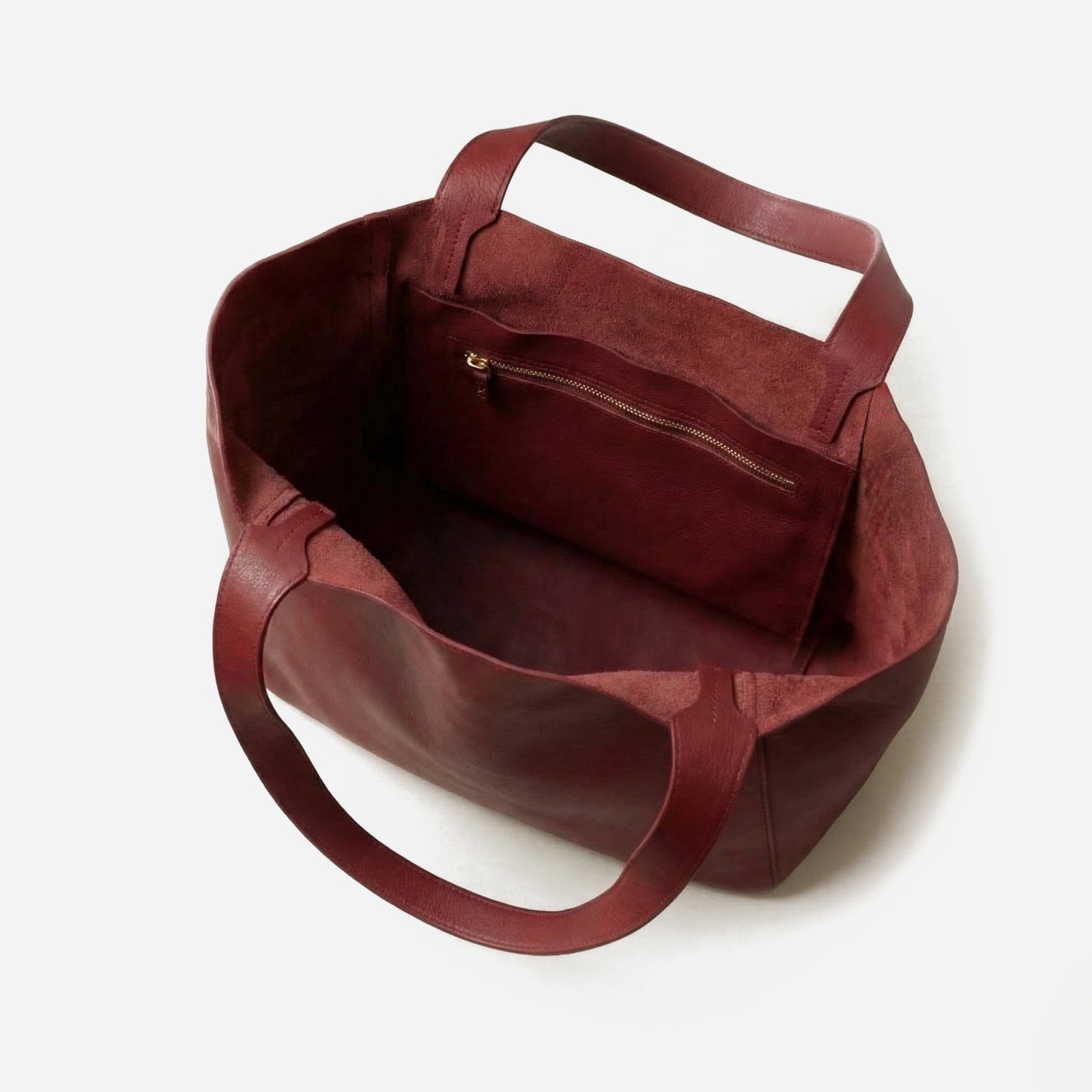 Maroon handbag on a white background - Cherry Cola