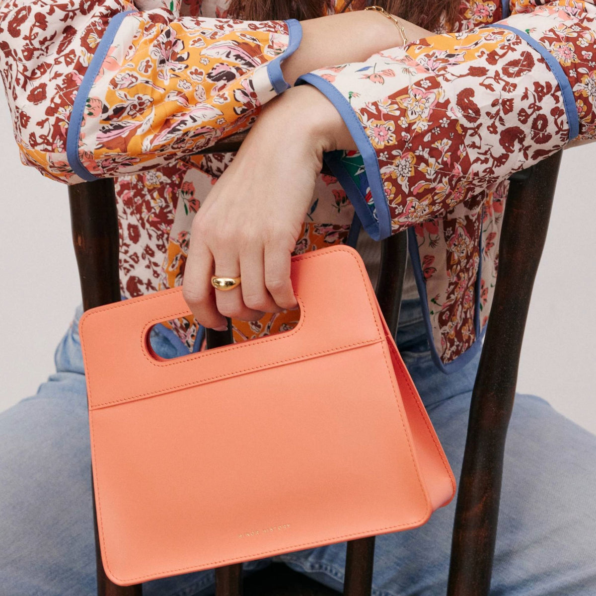 Lifestyle brand image with Minor History handbag in soft lighting