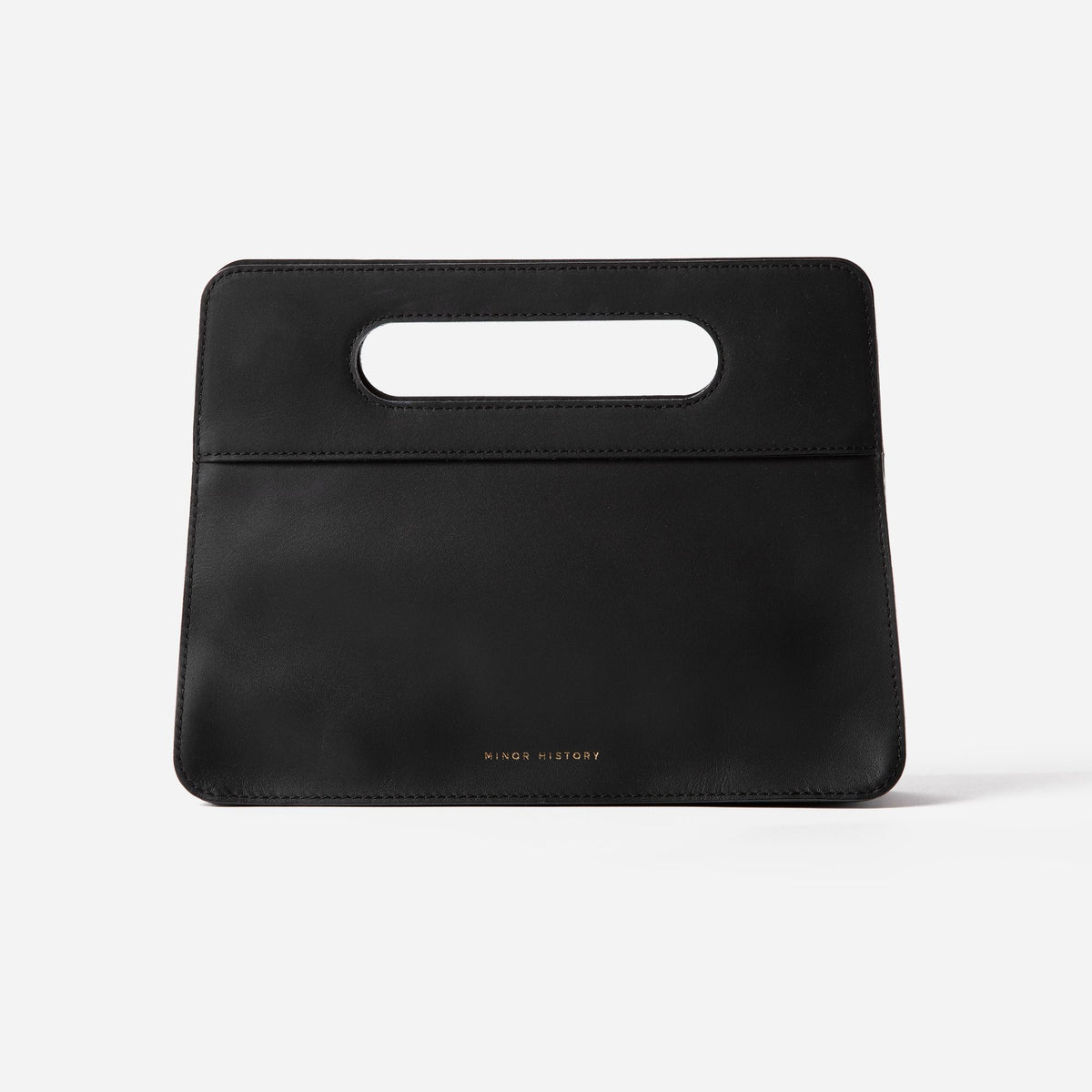 Lifestyle photo of Minor History leather bag - warm toned editorial setting