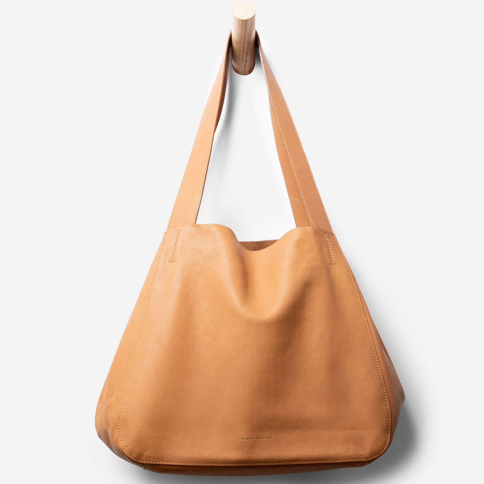 Detail shot of Times Tote bag hardware and structure