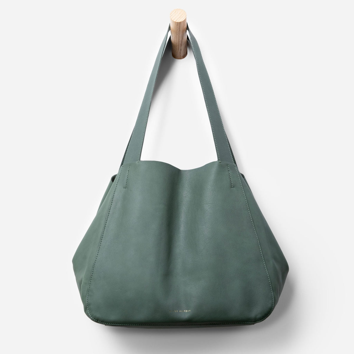 Close-up of Times Tote handles showing stitching and texture