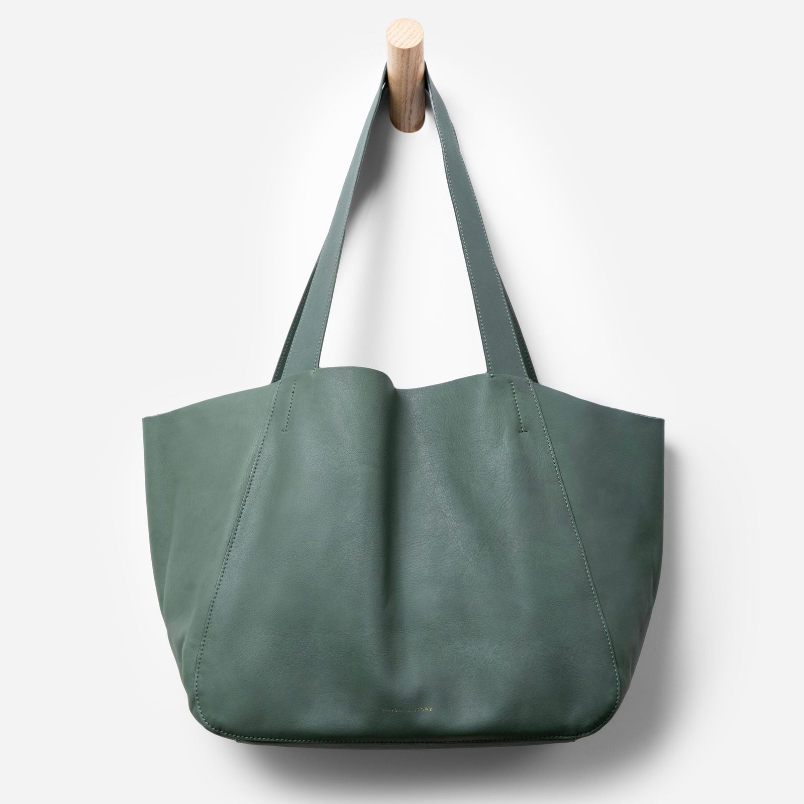 Styled lifestyle shot of Times Tote handbag for modern workwear